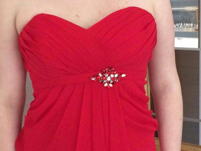 Preview of the first image of Stunning New Red Prom Dress for Sale - Size 12 / 14.