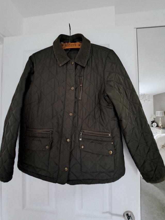 Preview of the first image of M+S LADIES KHAKI QUILTED JACKET SIZE 16.