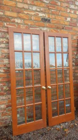 Image 1 of 2x Wooden Doors with Full Glass Lattice & Brass Knobs 690mm