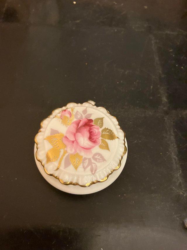 Preview of the first image of Small Coalport trinket pot with lid with flower decoration.