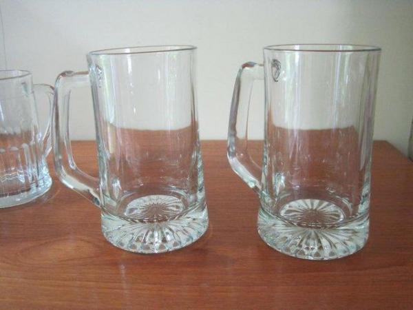 Image 2 of Four old glass tankards, which have not been used