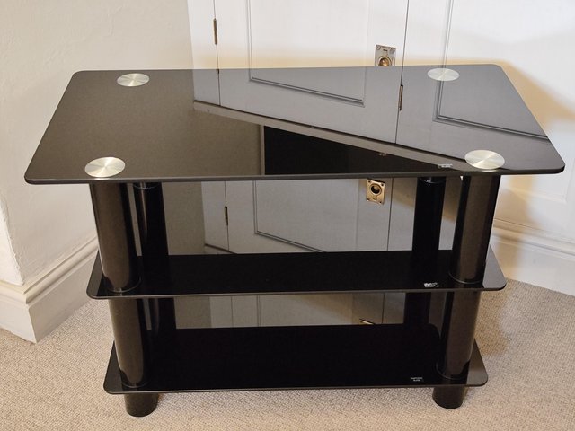 Preview of the first image of Black glass shelved TV table.