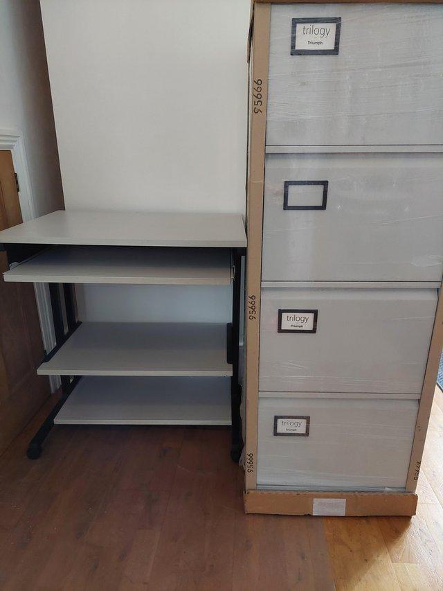 Preview of the first image of NEW LIGHT GREY  4 DRAW METAL FILING CABINET + LIGHT GREY DE.