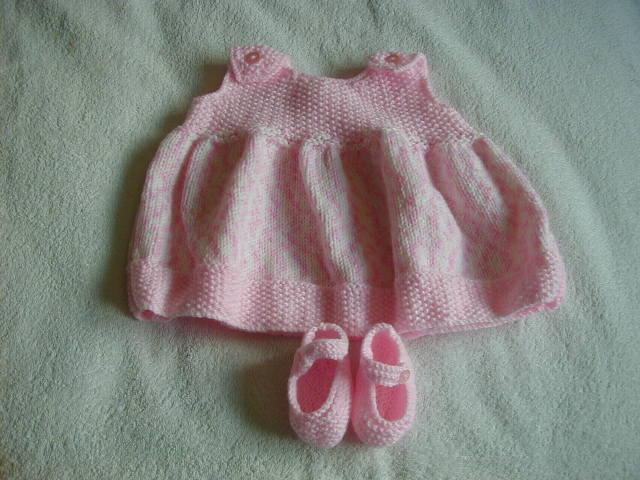 Preview of the first image of Hand Knitted Baby Dress And Shoes.