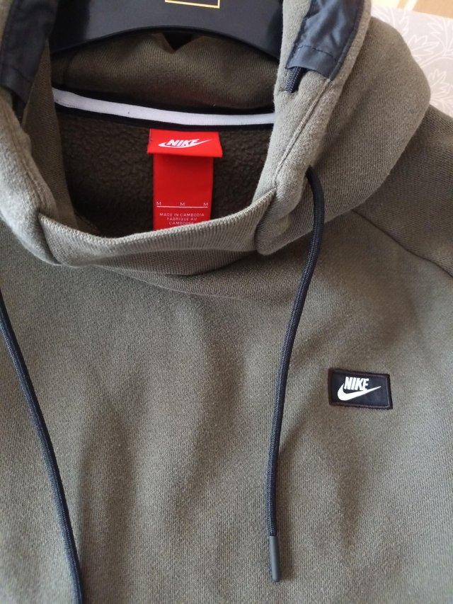 Preview of the first image of NIKE mens khaki hoodie sweatshirt size medium.