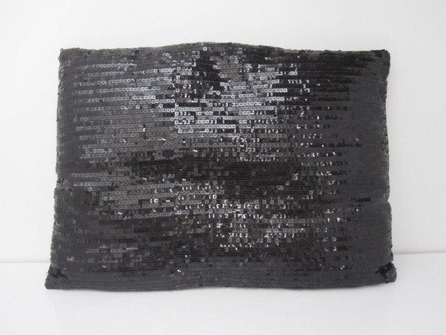 Preview of the first image of Black sequins cushion excellent.
