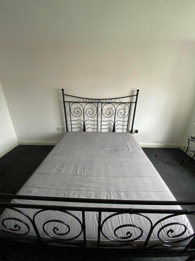 Preview of the first image of STRIKING IKEA black metal SuperKing size bed frame &mattress.