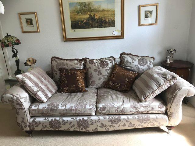 Preview of the first image of Neutral patterned silky covered 3 seater settee /sofa.