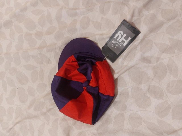 Preview of the first image of Silk cover for riding hat. Not worn..