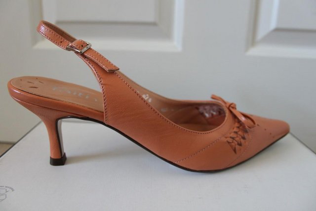 Preview of the first image of ladies peach sling back shoes.