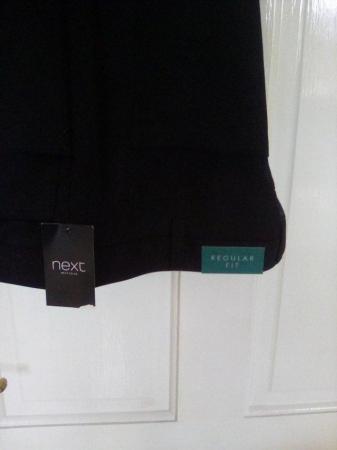 Image 2 of Men's black trousers never worn
