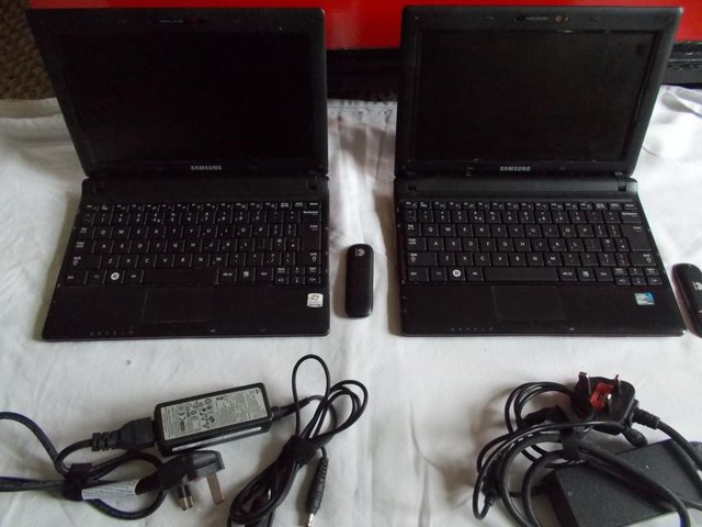 Preview of the first image of 2 Samsung N145 Plus Netbook laptops 2 Dongles 2 Chargers.