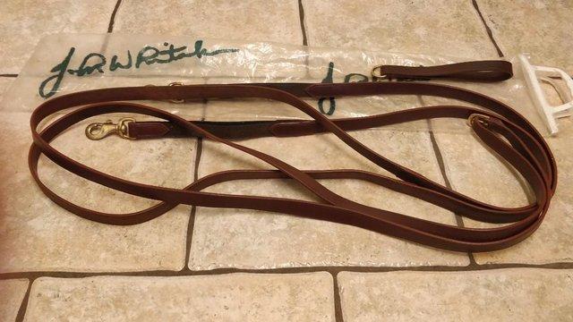 Preview of the first image of JOHN WHITAKER BROWN LEATHER ELASTICATED DRAW REINS.
