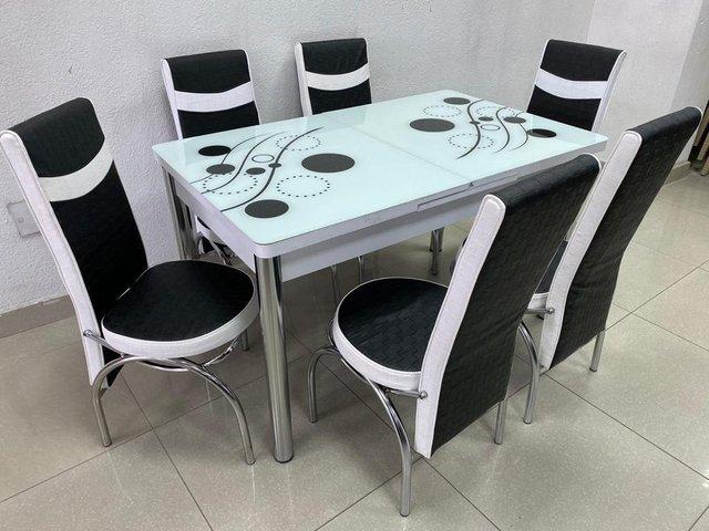 Preview of the first image of BRAND NEW TABLE WITH SETS SALE.