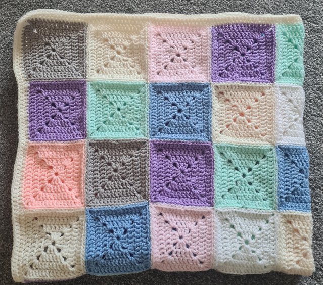 Preview of the first image of Crochet baby unisex cot size blanket.