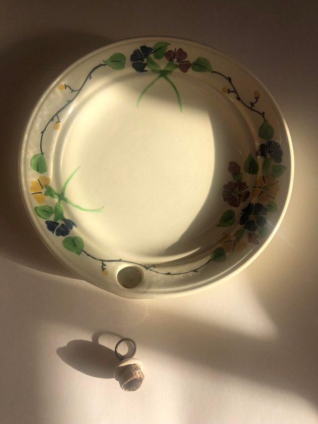 Preview of the first image of Vintage Crescent child’s ceramic plate warmer, floral.