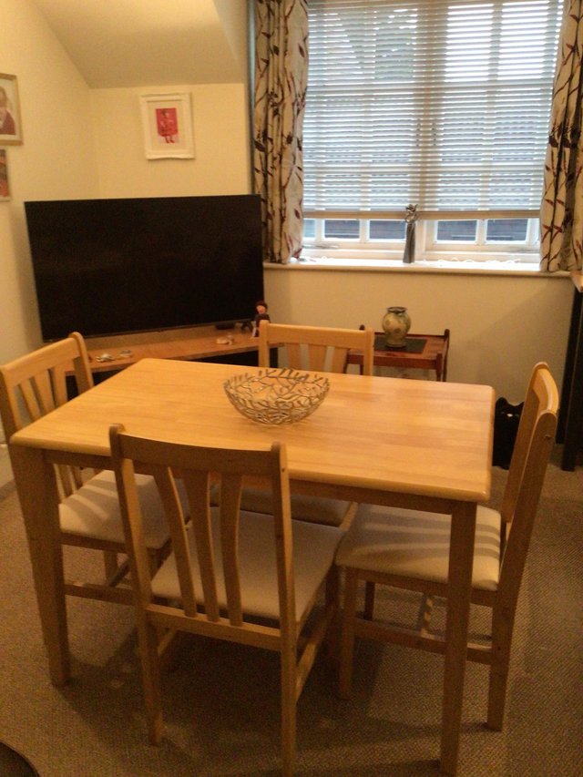 Preview of the first image of Dining table and four chairs.
