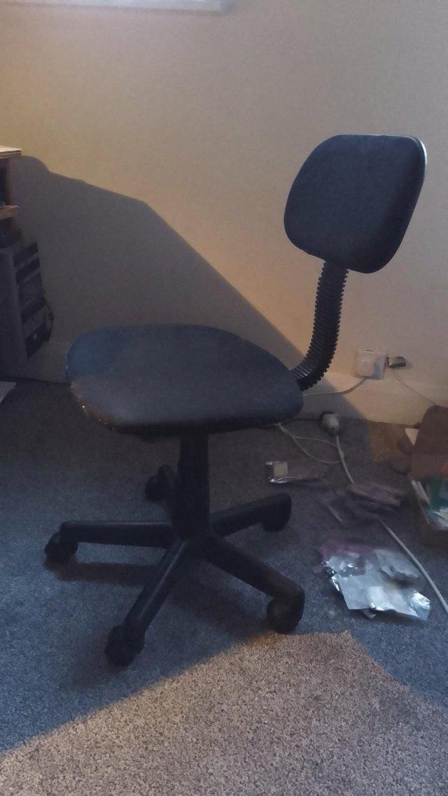 Preview of the first image of Office chair, adjustable, with wheels.