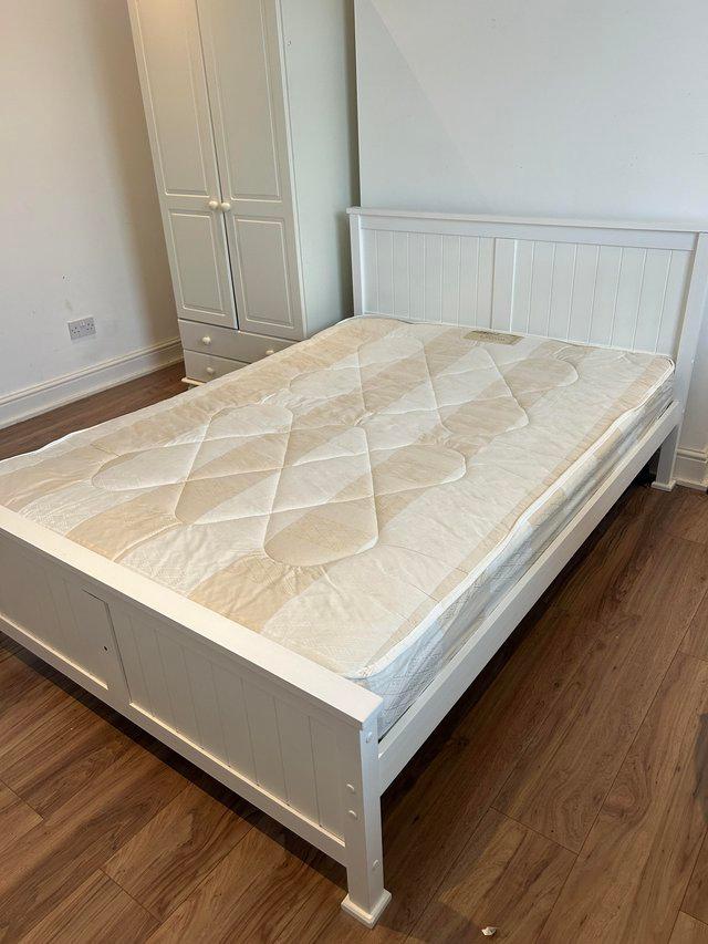Preview of the first image of Double bed frame with mattress for sale.