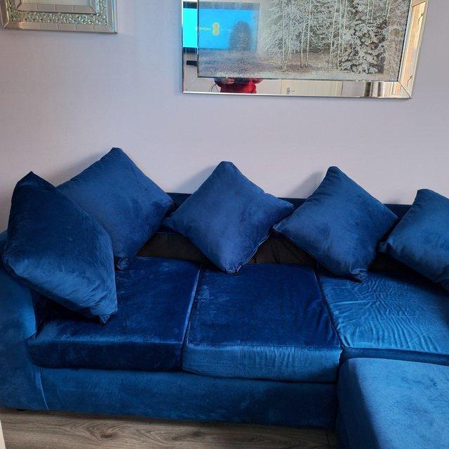 Preview of the first image of Brand new blue velvet corner sofa. Now reduced in price.