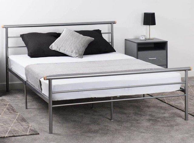 Preview of the first image of Double Orion silver metal bed frame.