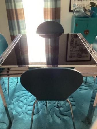 Image 2 of Black Glass Table, 4 teal blue chairs.