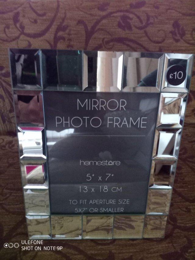 Preview of the first image of Mirror tiled photo frame new, for 5 inch by 7 inch photo.