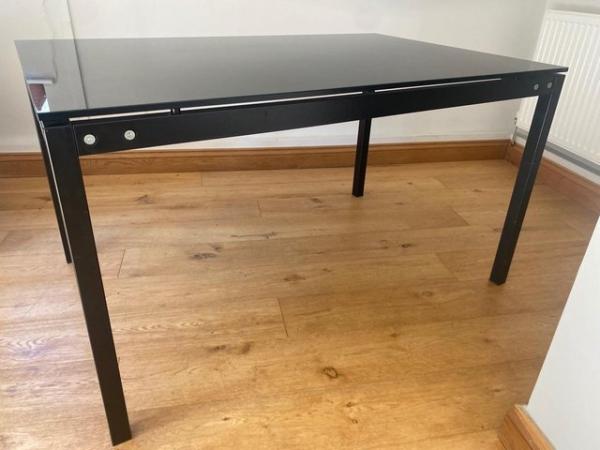 Image 1 of Callagaris black glass top dining table