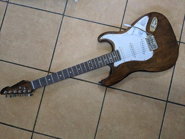Preview of the first image of Stratocaster Style Electric Guitar in Dark Oak.