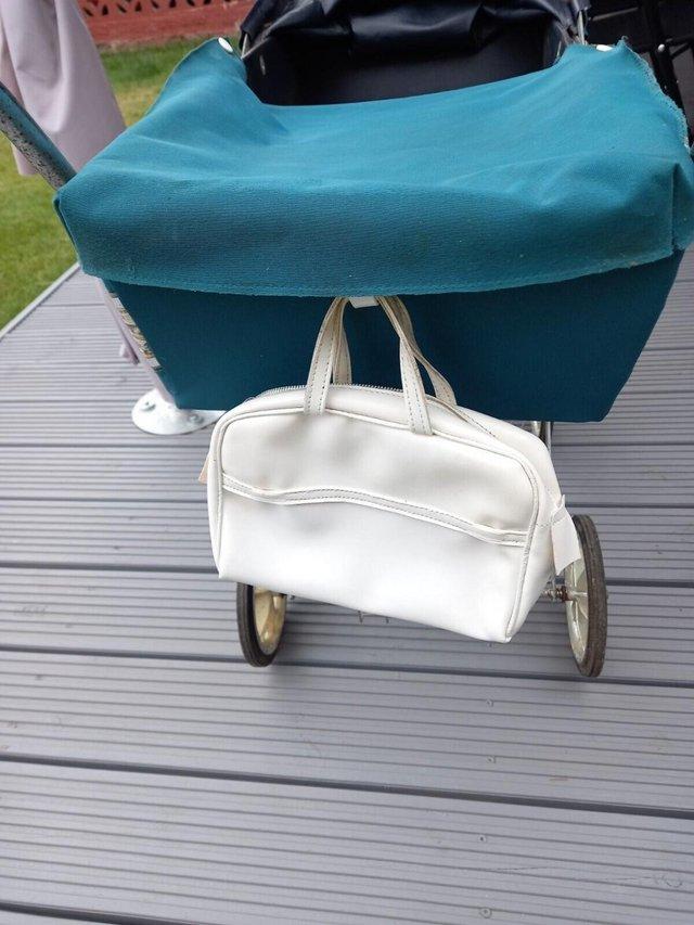 Preview of the first image of Vintage Retro 70's dolls pram metal frame with original baby.