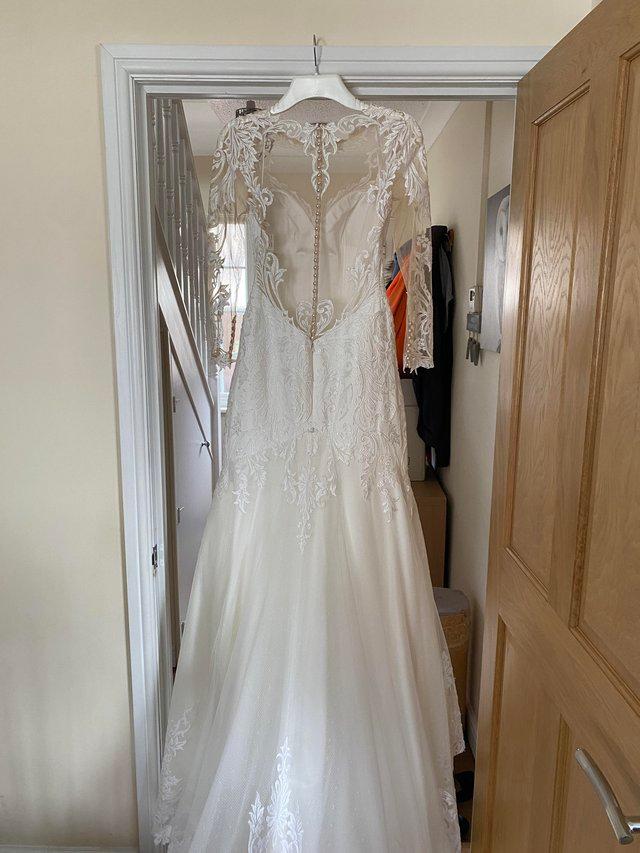 Preview of the first image of Mark Lesley size 12 bridal gown.