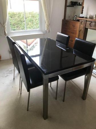 Image 3 of Glass topped dining room table and 4 matching chairs