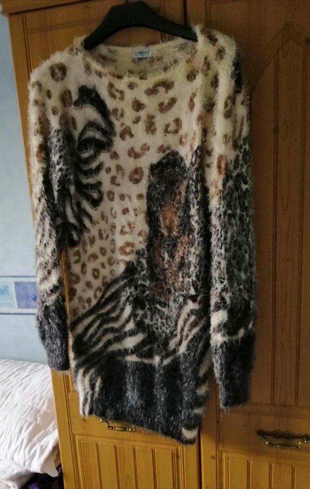 Preview of the first image of Brand New Tiger Print Fluffy Jumper Size 10/12.