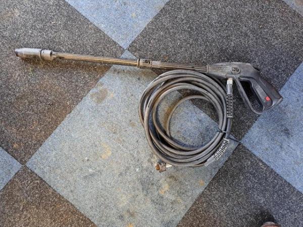 Image 1 of Pressure washer gun and long hose.