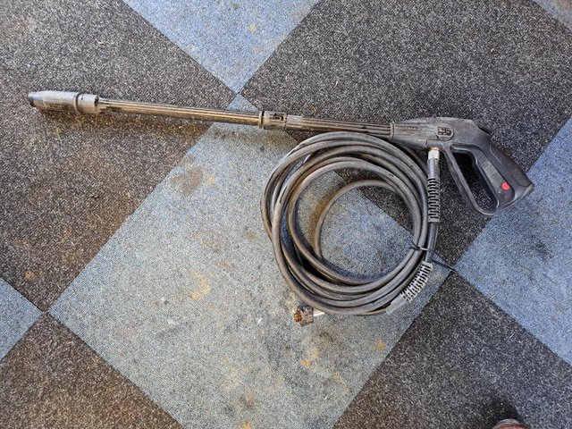 Preview of the first image of Pressure washer gun and long hose..