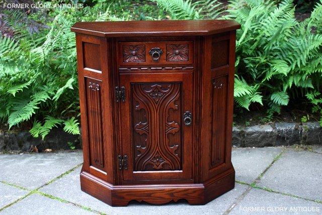 Preview of the first image of OLD CHARM TUDOR OAK CANTED HALL TABLE CABINET CUPBOARD STAND.