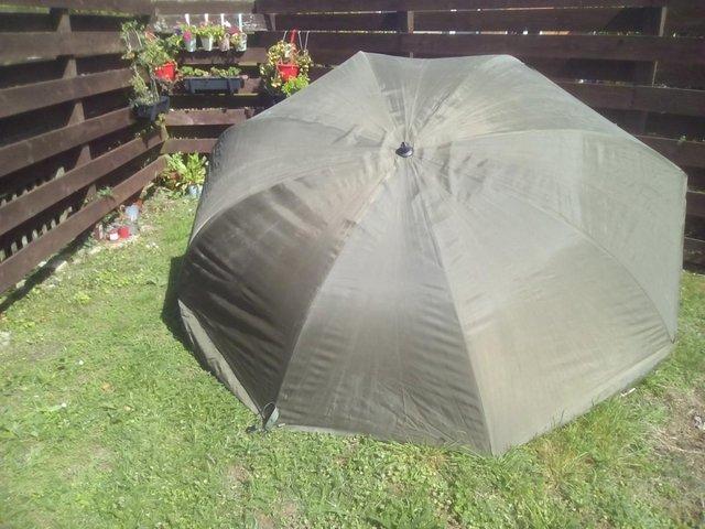 Preview of the first image of used storm brolly with poles£15.00 or make an offer.