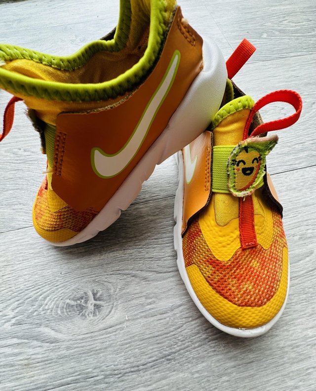 Preview of the first image of Nike avocado shoes orange and green.
