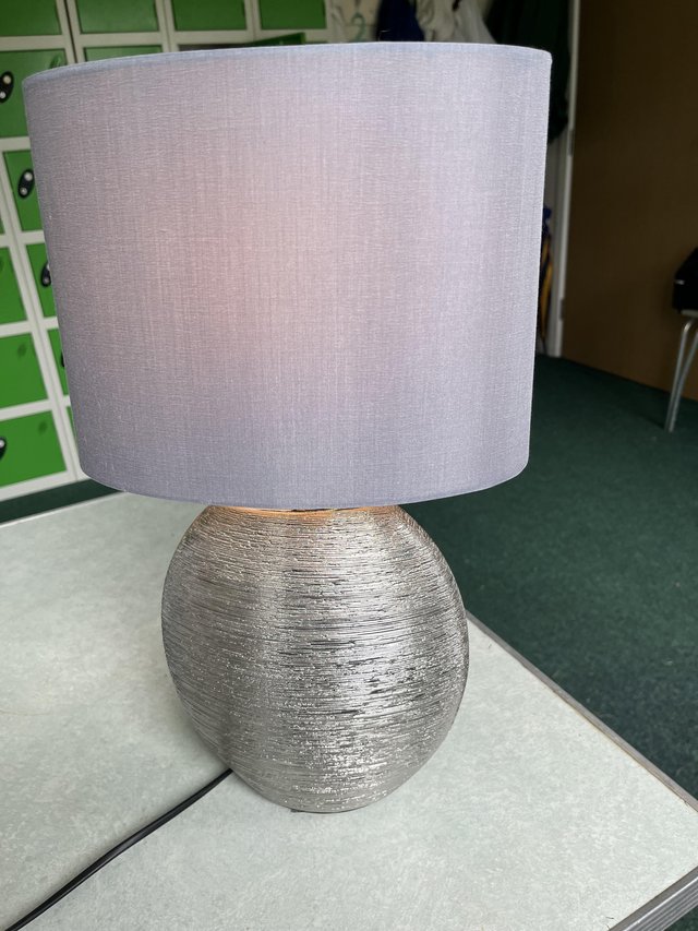 Preview of the first image of Table lamp with oval shade and oval base.