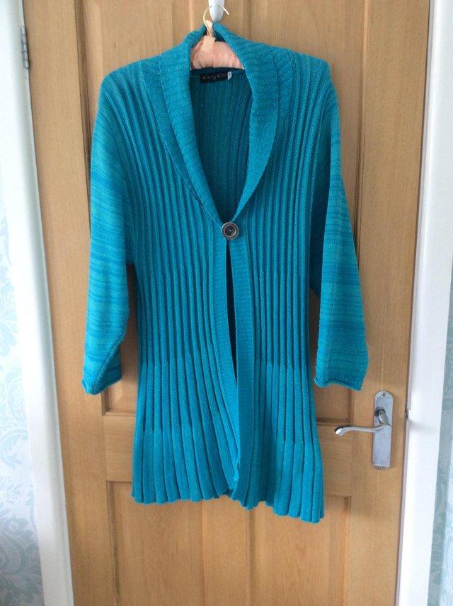 Preview of the first image of Long Length Torquoise Cardigan.