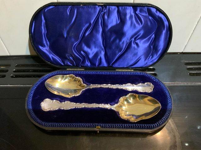 Preview of the first image of Silver & Gilt Pair of Serving Spoons in their original Case.