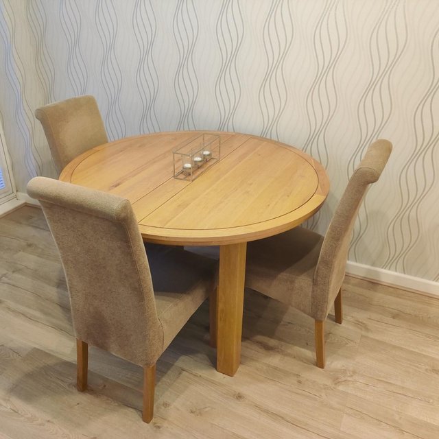 Preview of the first image of oak extending dining table and 6 chairs.