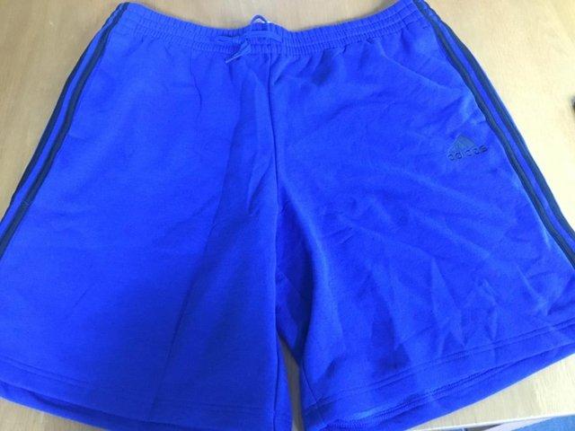 Preview of the first image of Adidas fleece shorts Mens XXL, brand new with tags.