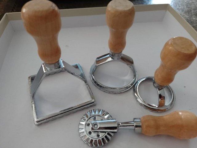 Preview of the first image of NEW unused boxed 4 piece ravioli pasta cutters.