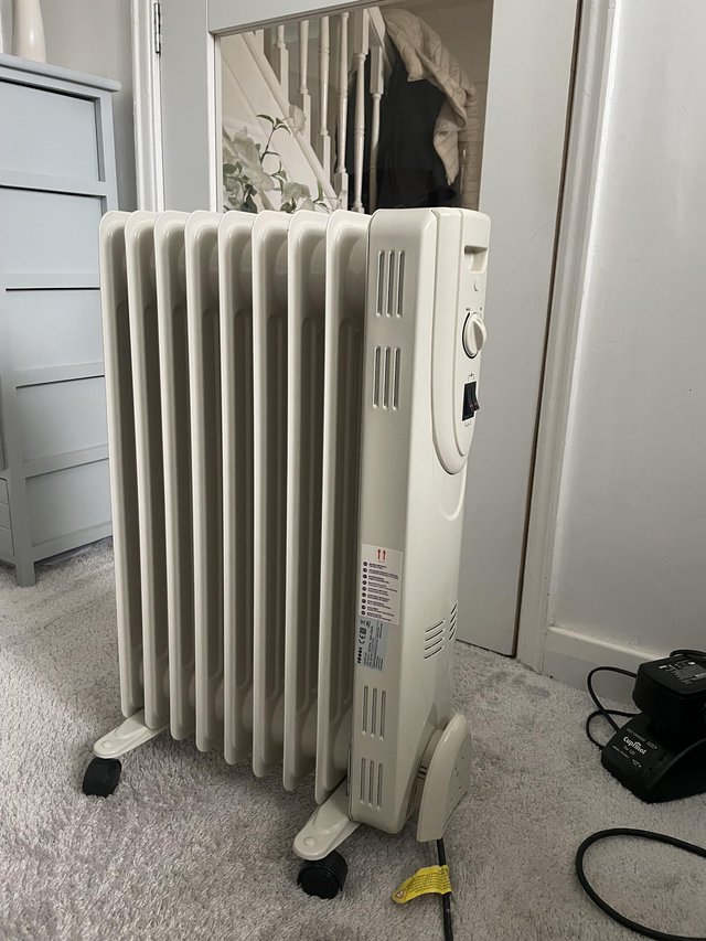 Preview of the first image of Portable Freestanding Wheeled Radiator Heater.