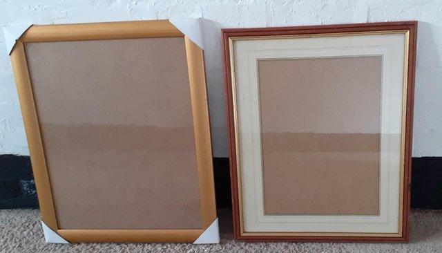Preview of the first image of 2 wooden picture frames - different sizes.