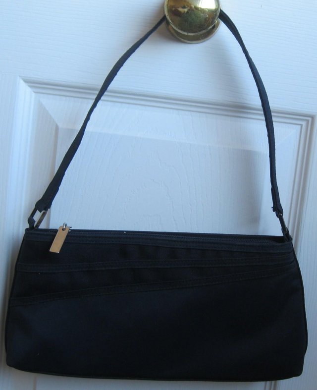 Preview of the first image of Small navy blue handbag............................