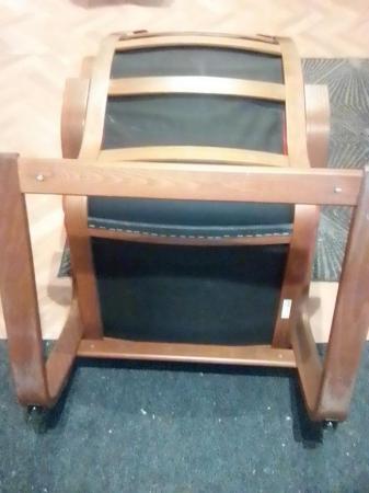 Image 3 of a burgundy poang chair and footstool for sale.