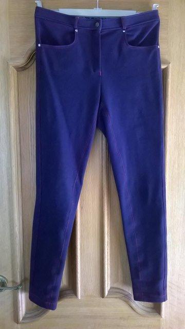 Preview of the first image of Riding Jodhpurs - Navy blue with pink stitching 28" waist.