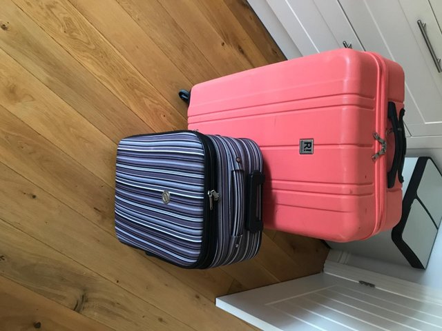 Preview of the first image of FREE - 1 large suitcase and 1 small suitcase.